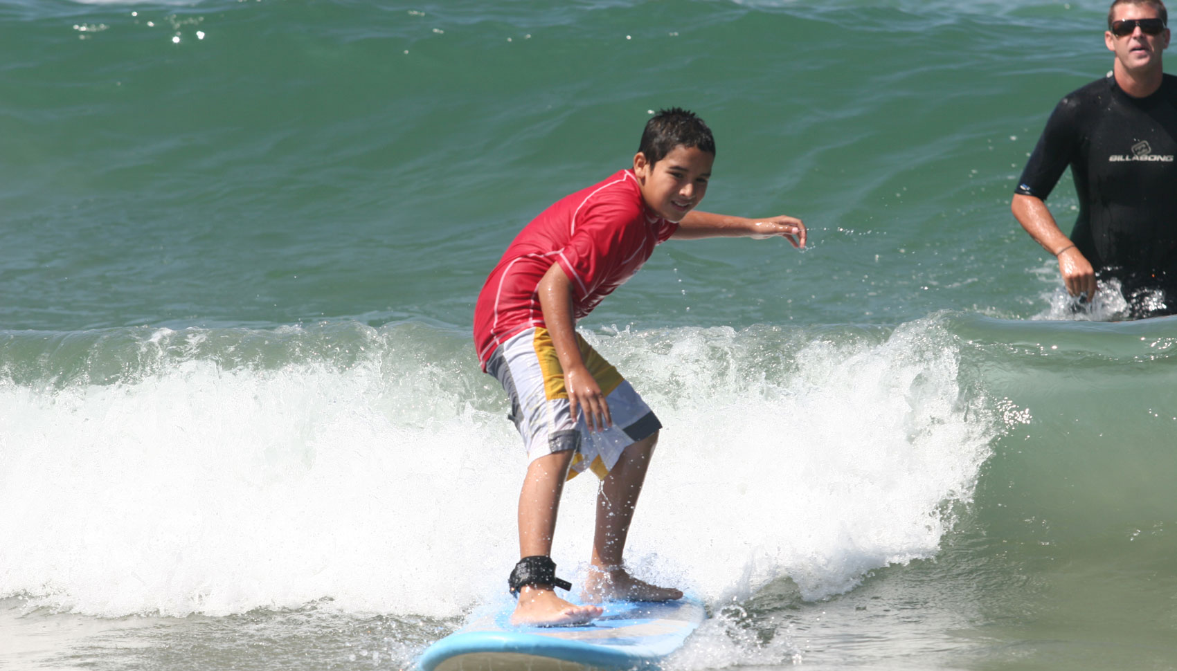 A participant surfing during a Jimmy Miller Memorial Foundation Ocean Therapy session