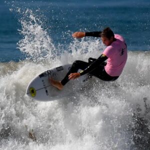 Surfer in pink jersey floater on the white water of a 5 foot wave Jimmy Miller Foundation Jimmy Surf Fiesta 2023 daily breeze article