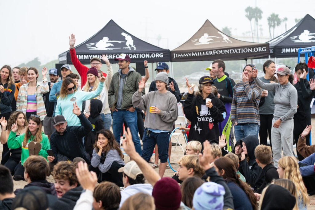 Group of onlookers watching the surf action in Manhattan Beach during the annual Jimmy Miller Foundation's Surf Fiesta